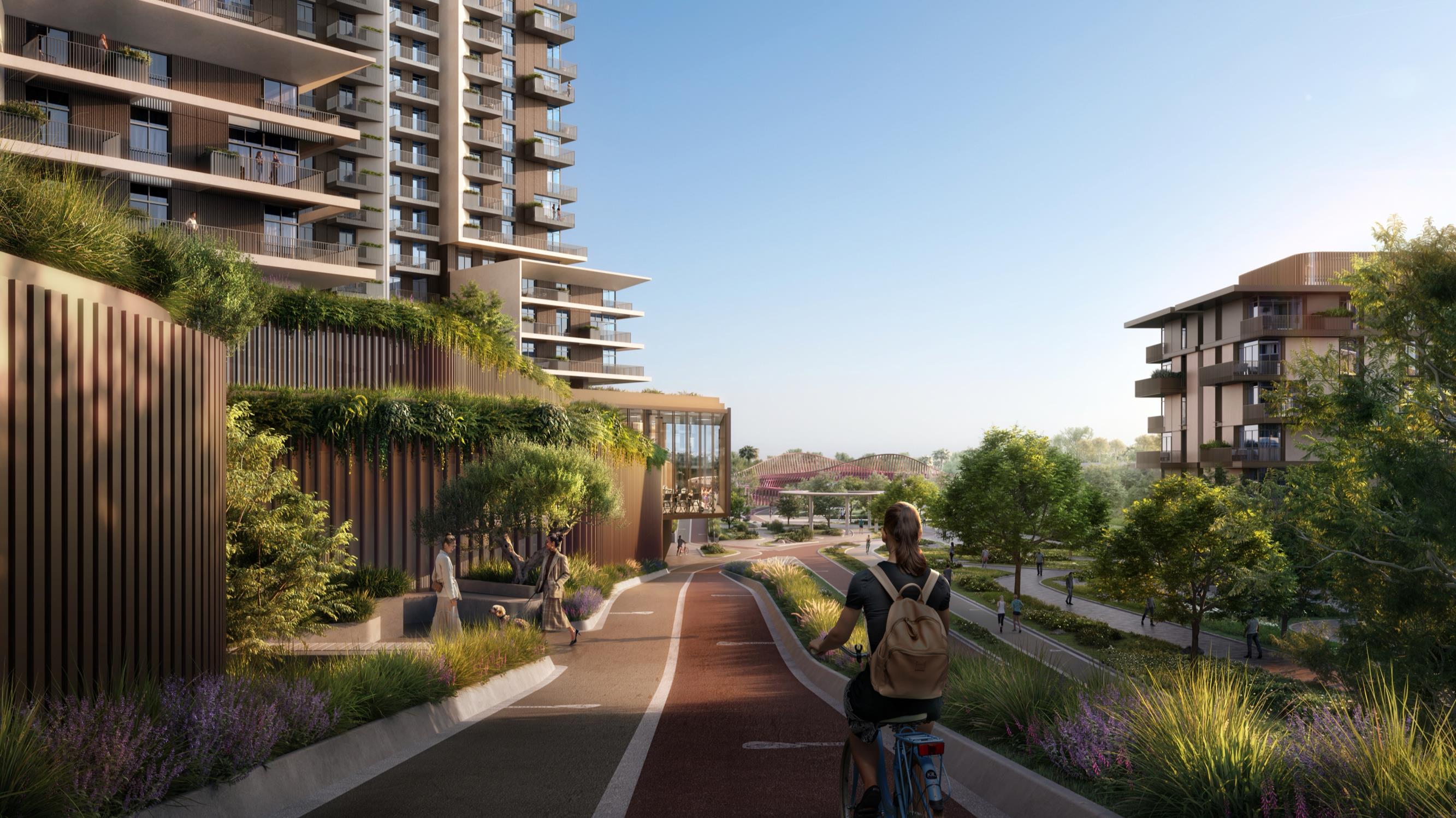 Tower view of Athlon Dubai development with contemporary architecture and landscaped podium areas