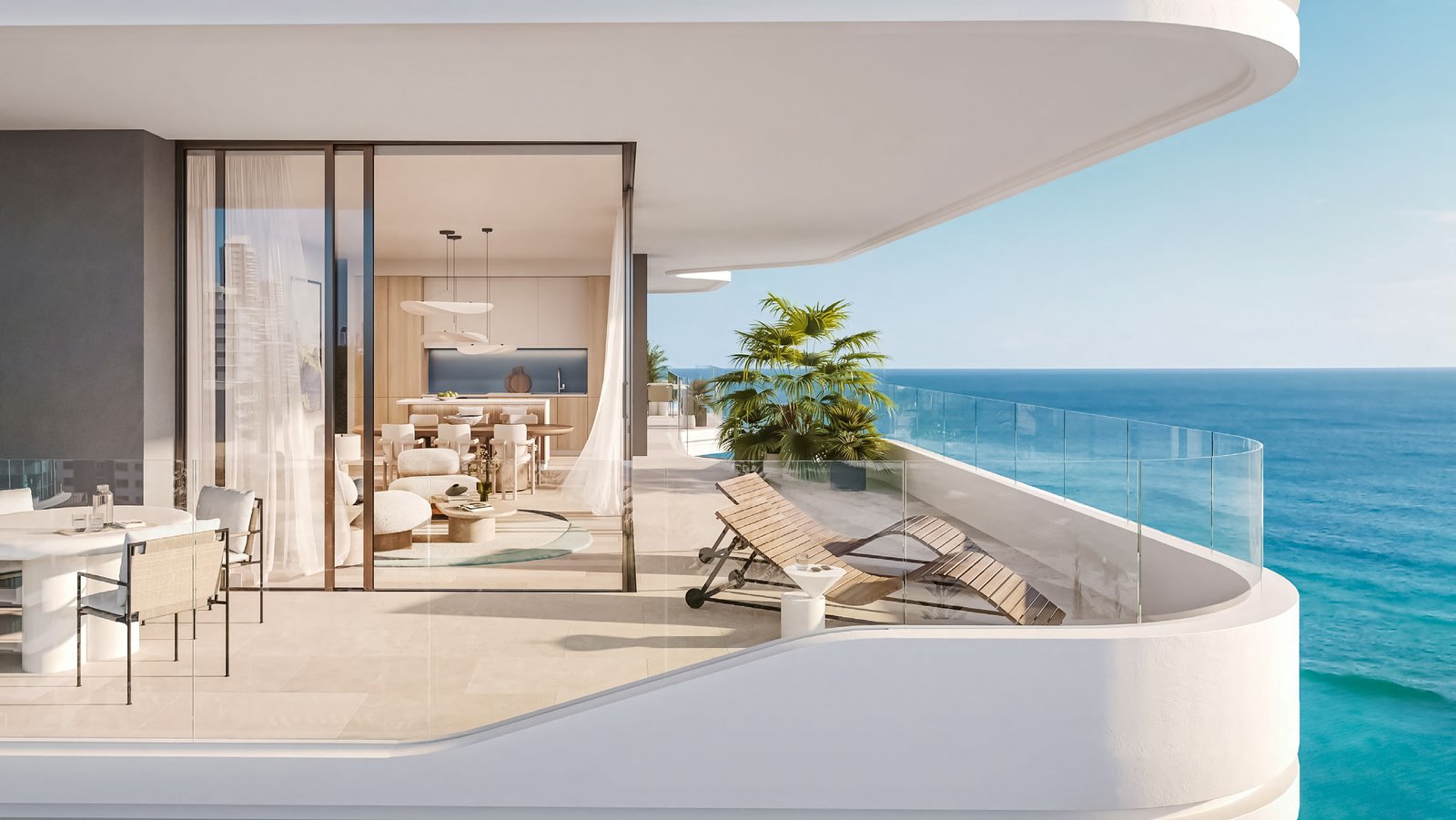 Luxurious beachfront living at Nikki Beach Residences by Aldar on Al Marjan Island, featuring stunning Arabian Gulf views from a spacious apartment balcony.